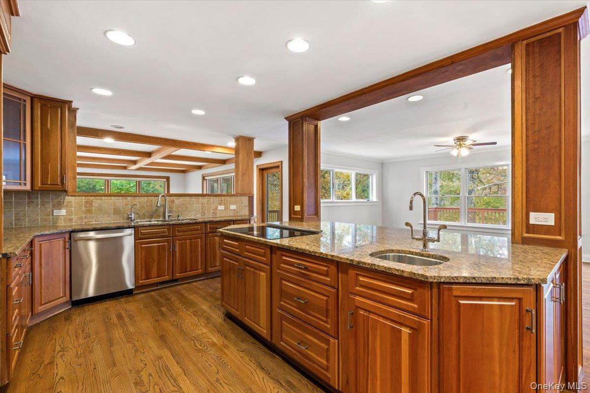 110 Oliver Road Bedford, NY 10506 - Photo 11 of 33 a kitchen with stainless steel appliances granite countertop a sink and wooden cabinets