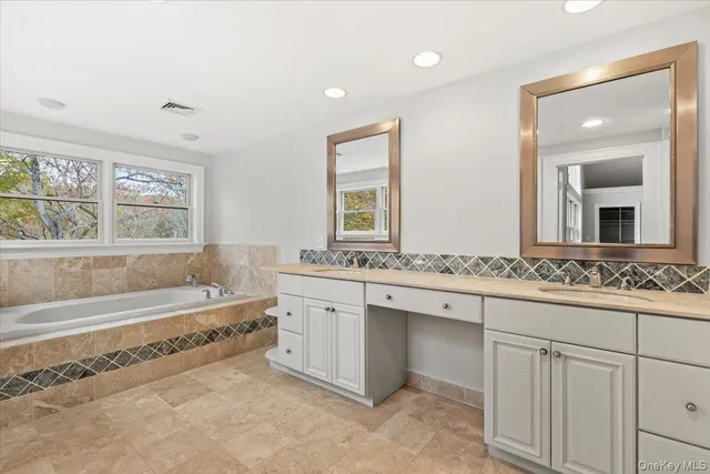 a bathroom with a sink and a bathtub