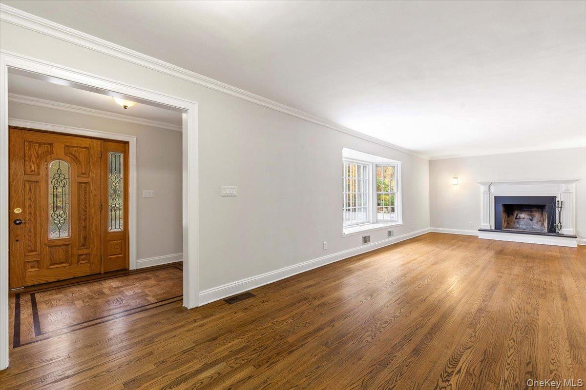110 Oliver Road Bedford, NY 10506 - Photo 2 of 33 a view of empty room with wooden floor and fan