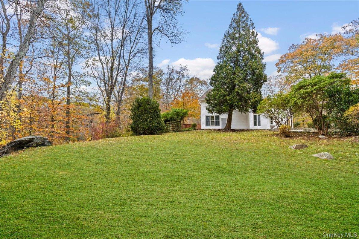 110 Oliver Road Bedford, NY 10506 - Photo 27 of 33 a front view of a house with a yard