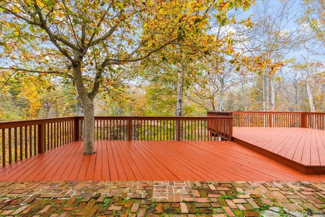 a balcony with trees in front of it