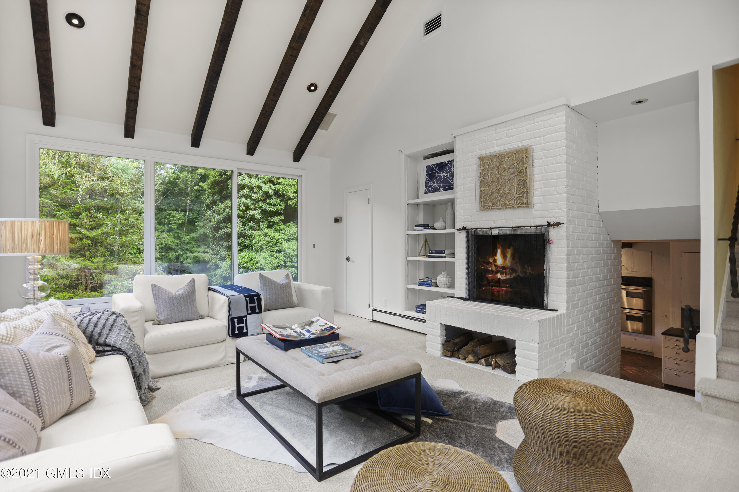 12 Guinea Road Greenwich, CT 06830 - Photo 11 of 29 a living room with furniture fireplace and a large window