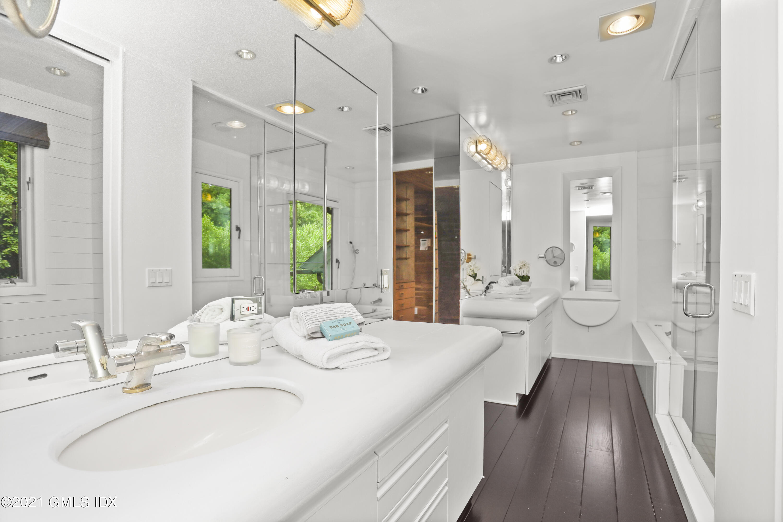 12 Guinea Road Greenwich, CT 06830 - Photo 14 of 29 a spacious bathroom with a granite countertop sink mirror and shower