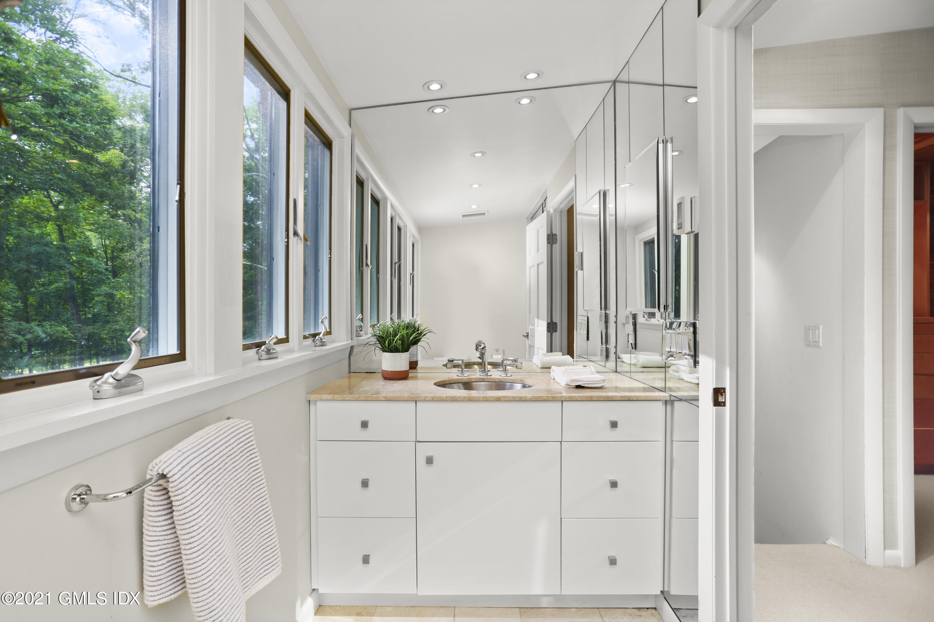 12 Guinea Road Greenwich, CT 06830 - Photo 17 of 29 a bathroom with a double vanity sink and mirror with bathtub