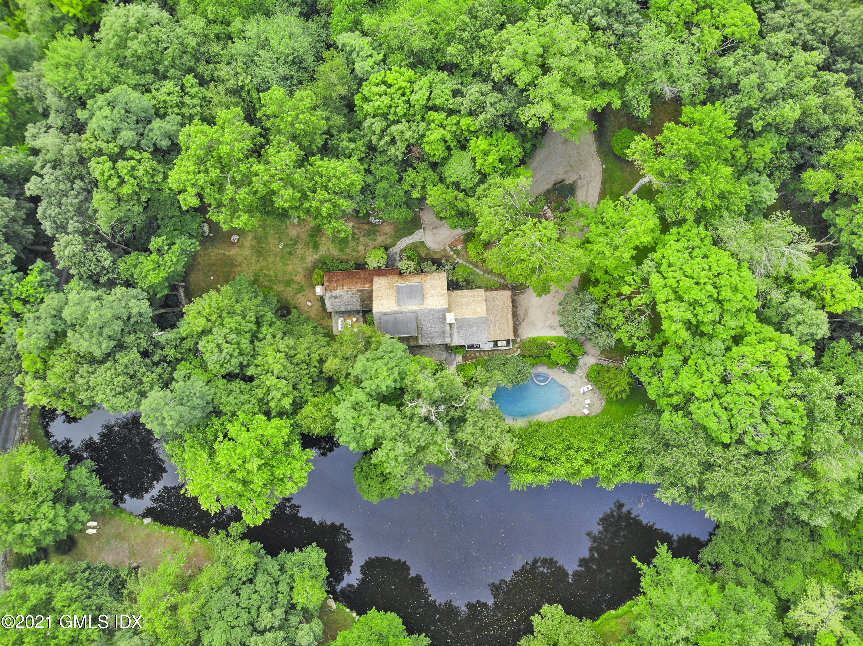 12 Guinea Road Greenwich, CT 06830 - Photo 2 of 29 an aerial view of a house with a garden and yard