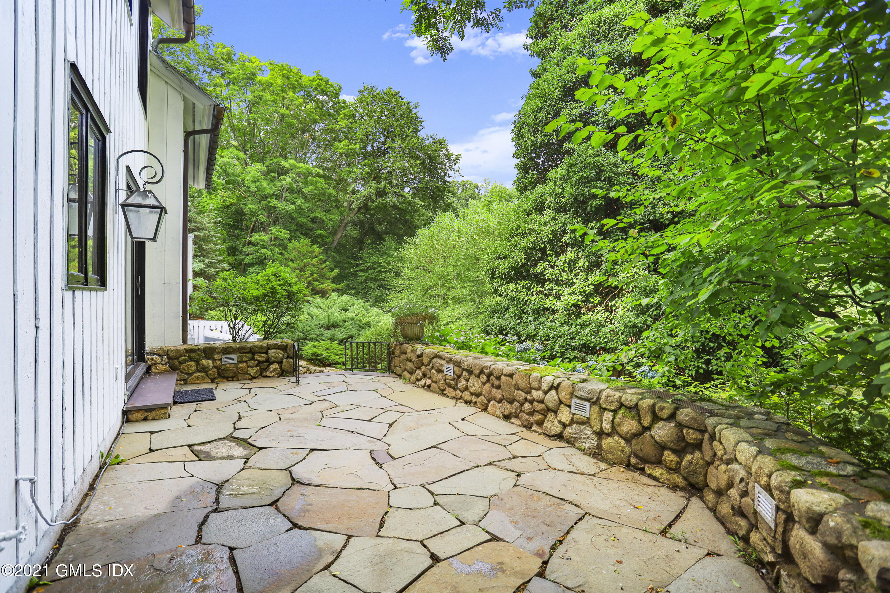 12 Guinea Road Greenwich, CT 06830 - Photo 21 of 29 a view of a back yard of the house