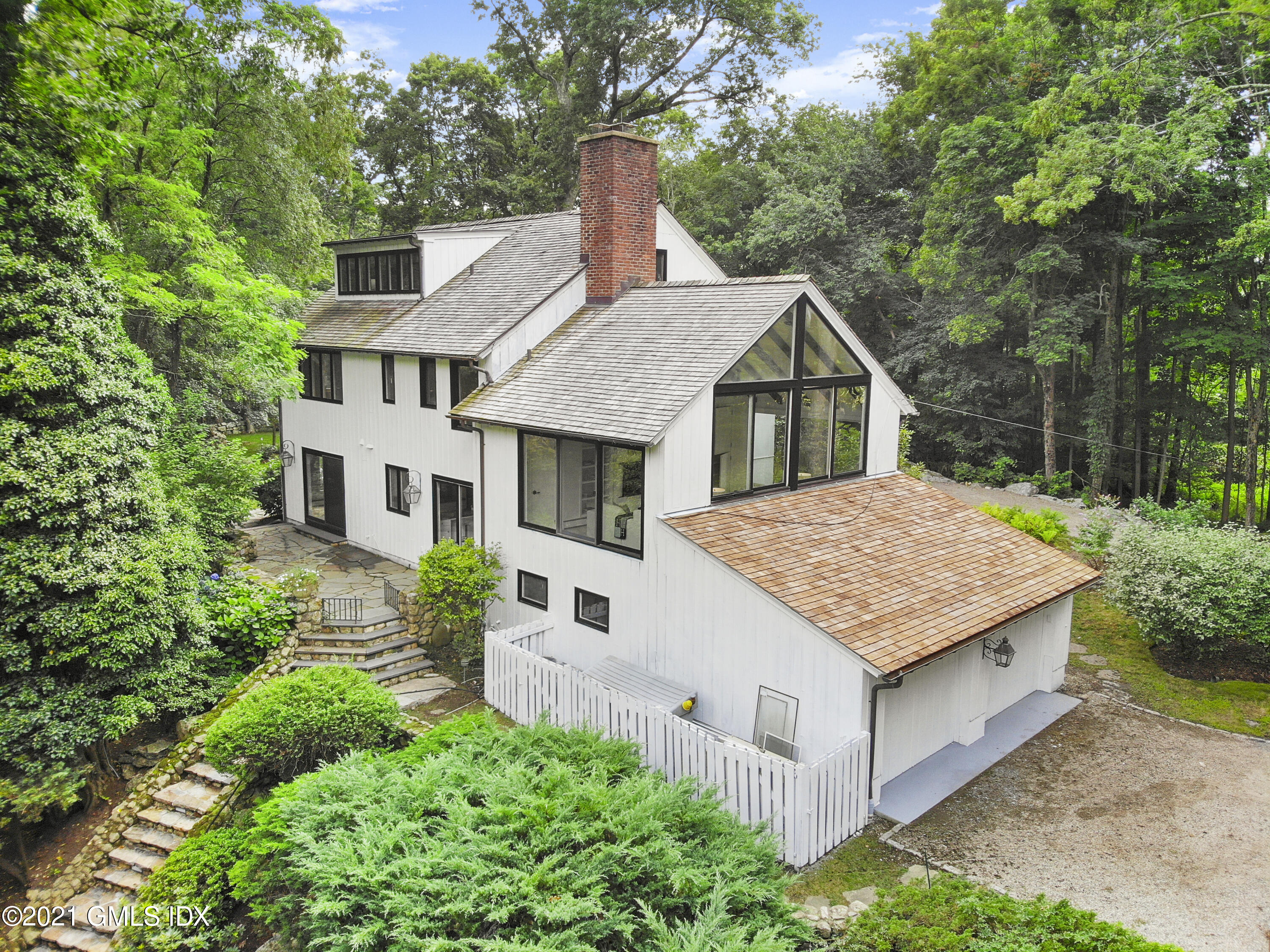 12 Guinea Road Greenwich, CT 06830 - Photo 23 of 29 a house view with a garden space