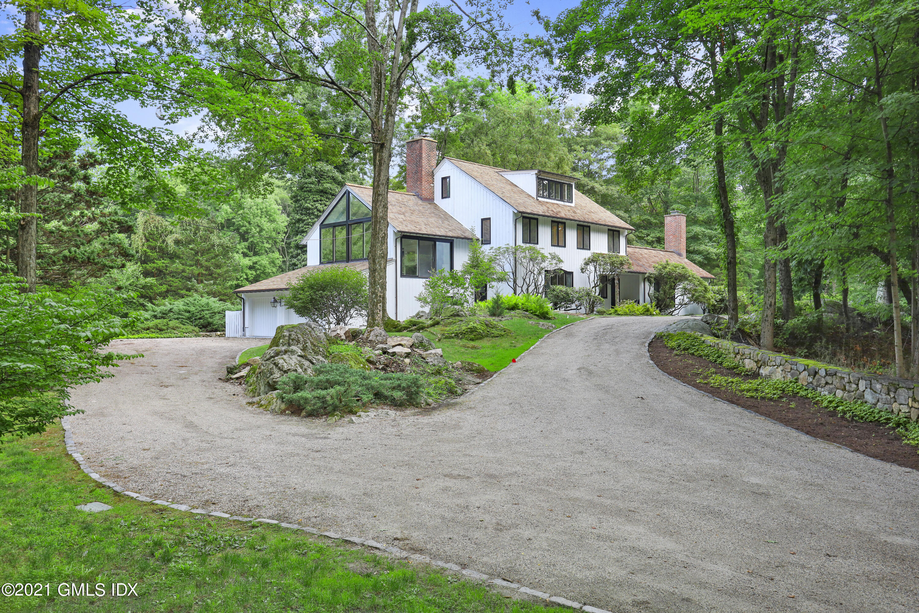 12 Guinea Road Greenwich, CT 06830 - Photo 24 of 29 a aerial view of a house with a yard and potted plants
