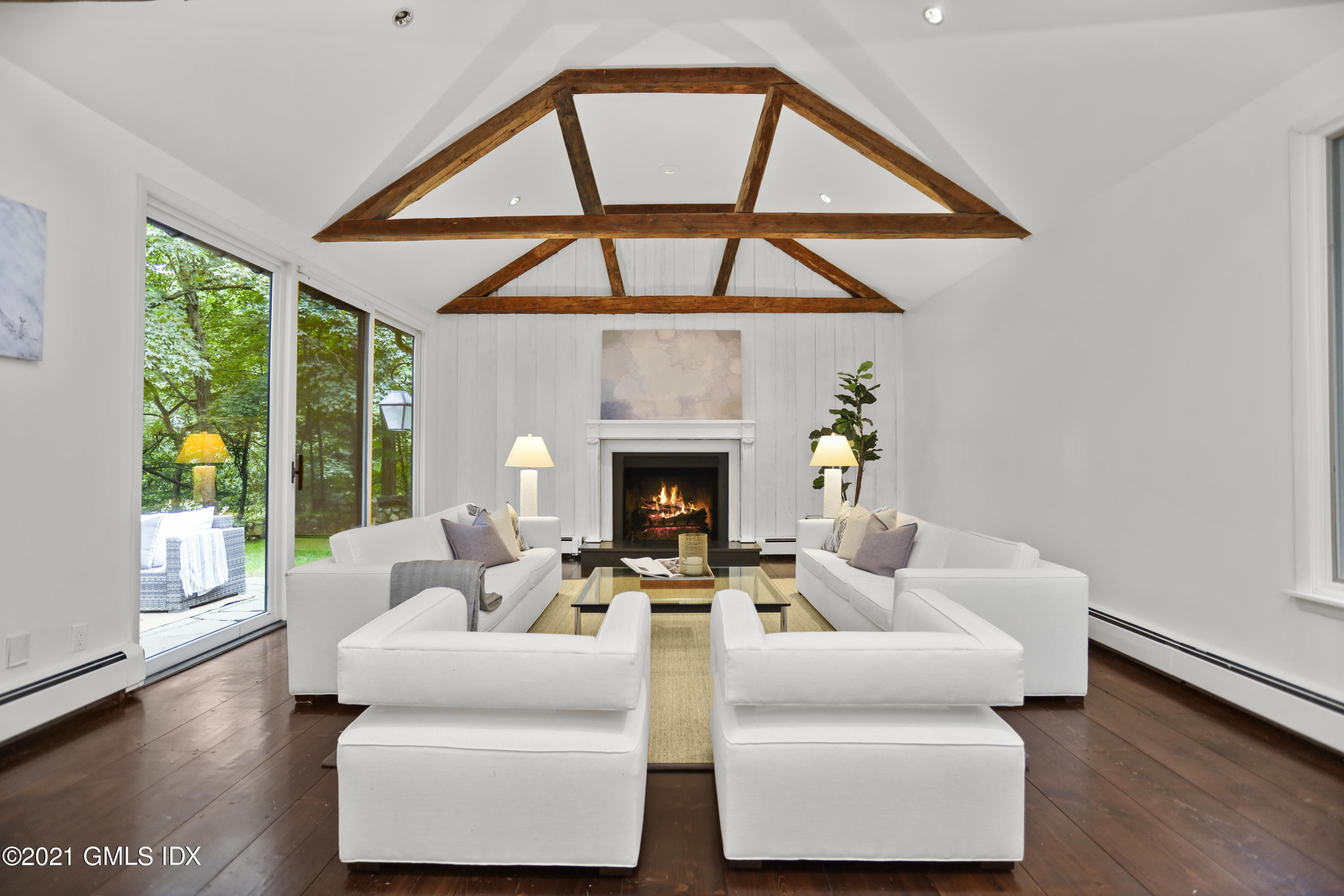 12 Guinea Road Greenwich, CT 06830 - Photo 6 of 29 a living room with furniture and a fireplace