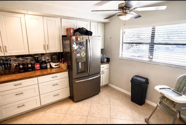 a bedroom with a bed and flat screen tv