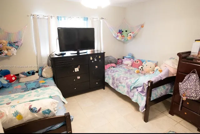 a bedroom with furniture and a closet