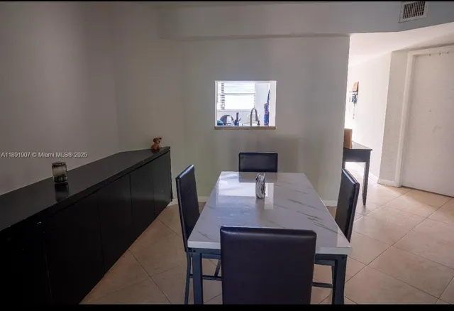 a view of a workspace with furniture