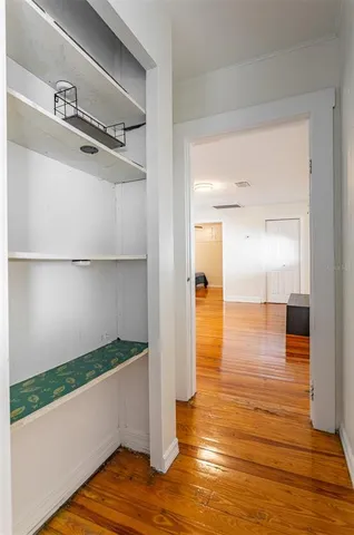 a view of a room with wooden floor