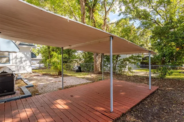 a view of a backyard with sitting area