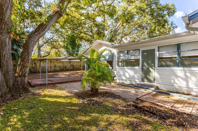 a view of a back yard of the house
