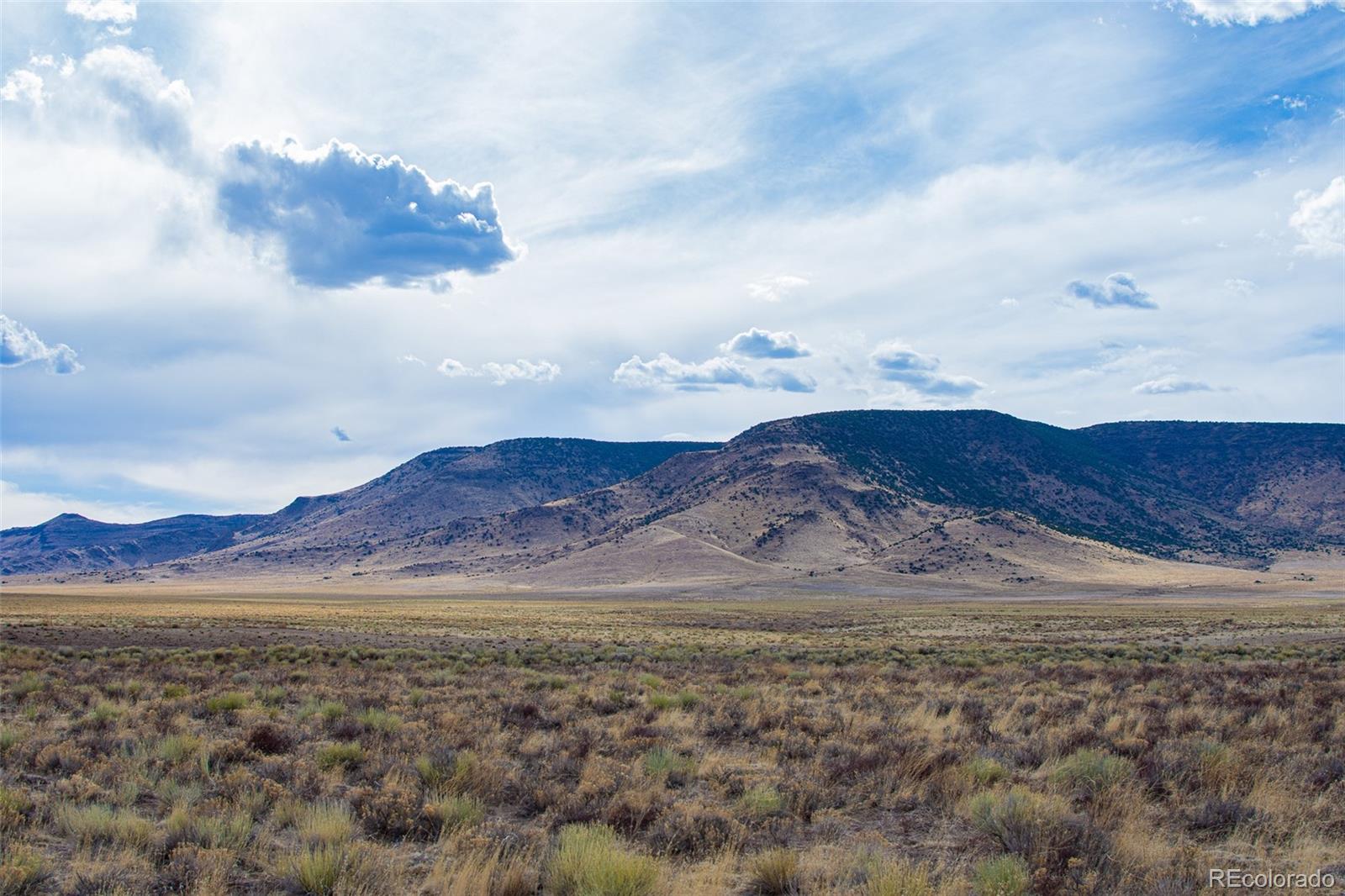 67 Kettledrum Road Sanford, CO 81151 - Photo 2 of 15 a view of mountain with sunset in background