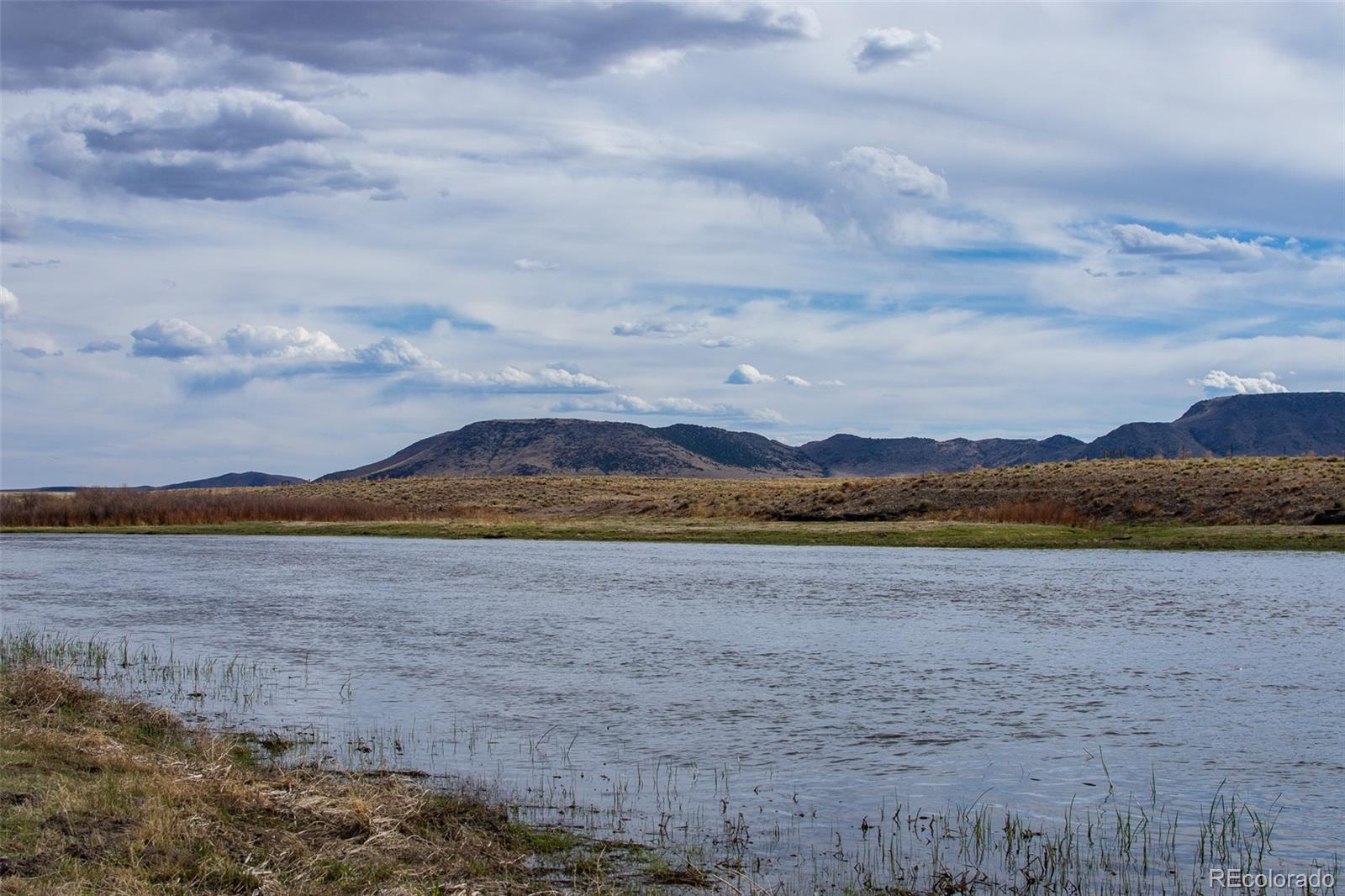 67 Kettledrum Road Sanford, CO 81151 - Photo 4 of 15 a view of lake view and mountain view
