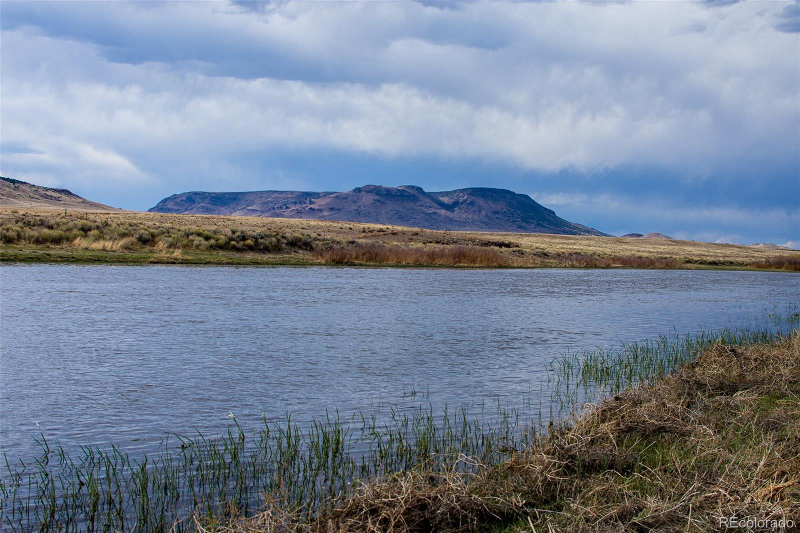 67 Kettledrum Road Sanford, CO 81151 - Photo 6 of 15 a view of lake and mountain