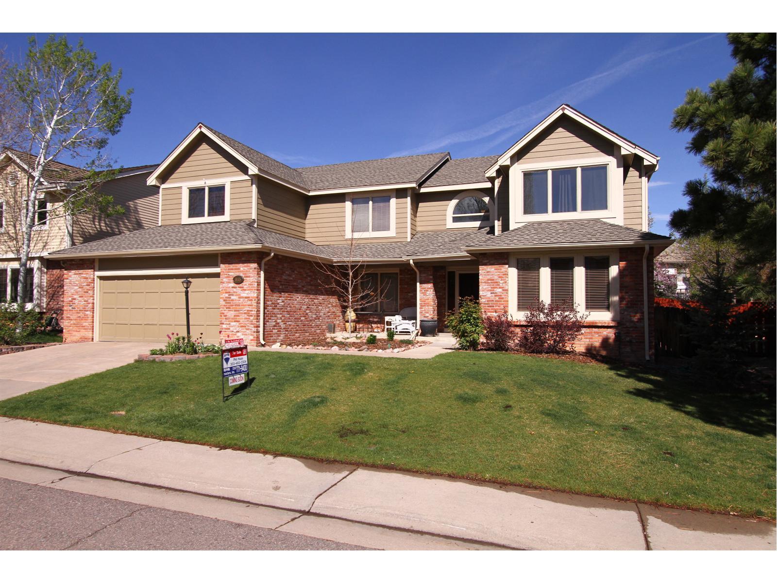 8145 Sweet Water Road Lone Tree, CO 80124 - Photo 1 of 1 a front view of a house with a yard