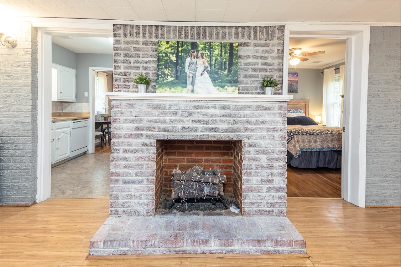 4611 Sea Isle Road Memphis, TN 38117 - Photo 13 of 24 a living room with furniture and a fireplace