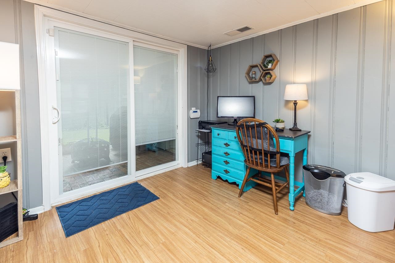 4611 Sea Isle Road Memphis, TN 38117 - Photo 14 of 24 a view of a room with wooden floor lounge chair and windows