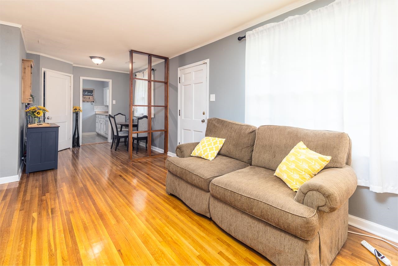 4611 Sea Isle Road Memphis, TN 38117 - Photo 7 of 24 a living room with furniture and a wooden floor