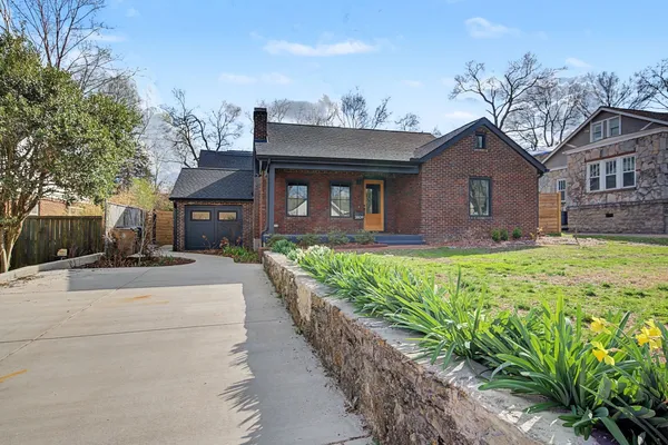 a front view of a house with garden