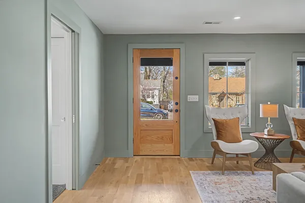 a bedroom with furniture and a window