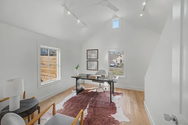 a workspace with furniture and a window