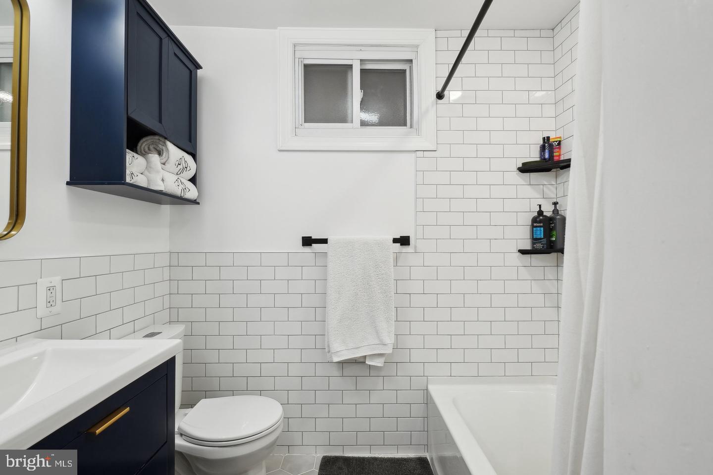 123 17th Street Southeast, Unit 2 Washington, DC 20003 - Photo 11 of 20 a bathroom with a toilet and a shower