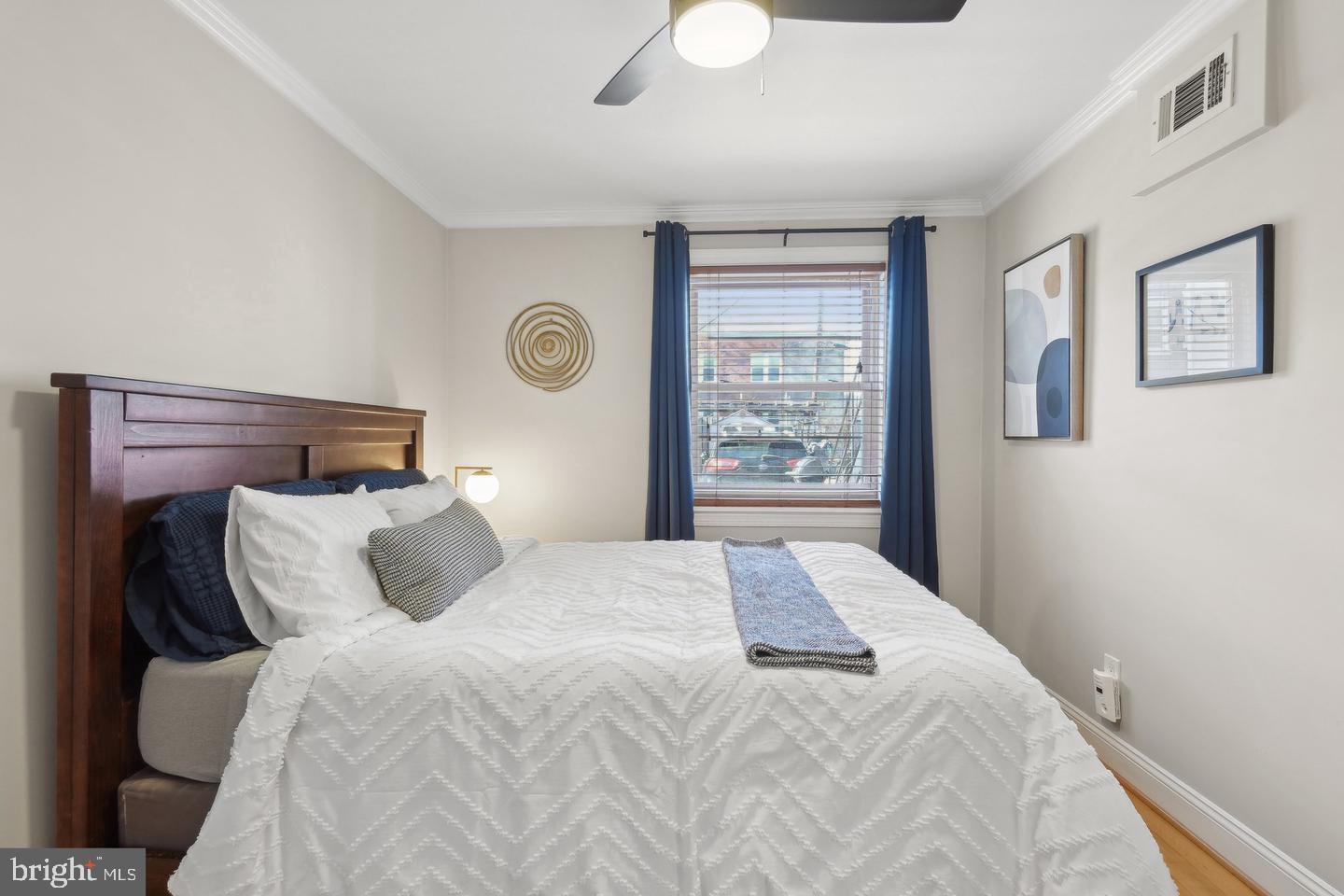 123 17th Street Southeast, Unit 2 Washington, DC 20003 - Photo 10 of 20 a bedroom with a bed and a window