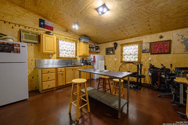 a dining room with furniture and a window