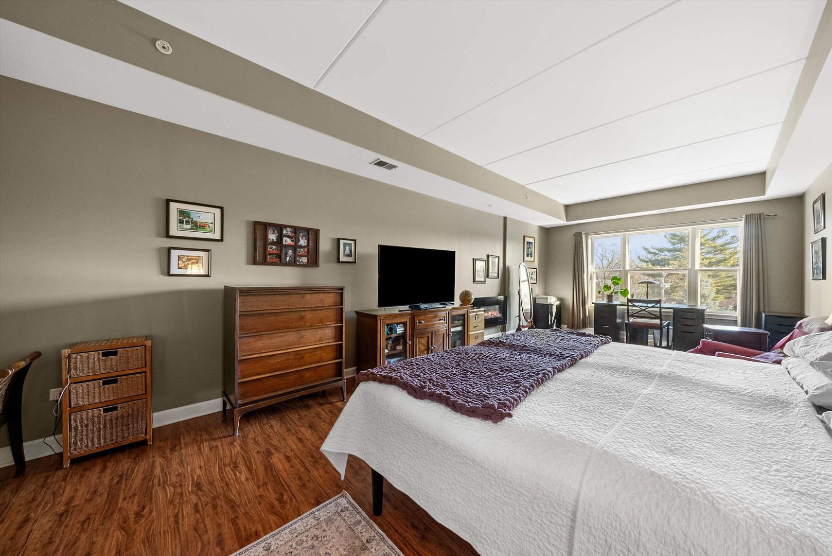 10 North Gilbert Street, Unit 314 South Elgin, IL 60177 - Photo 13 of 25 a bedroom with a bed and wooden floor