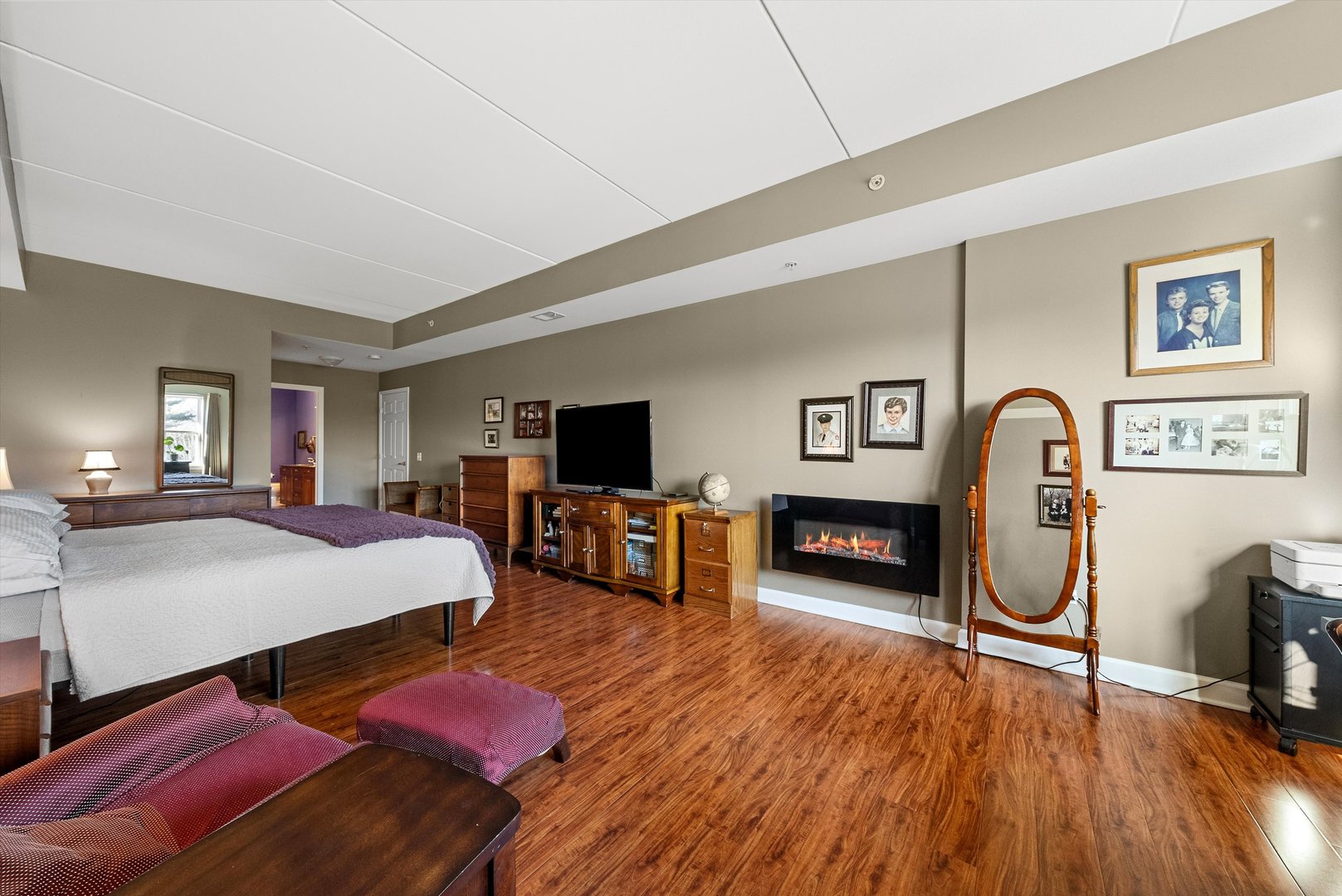 10 North Gilbert Street, Unit 314 South Elgin, IL 60177 - Photo 14 of 25 a bedroom with furniture and a wooden floor