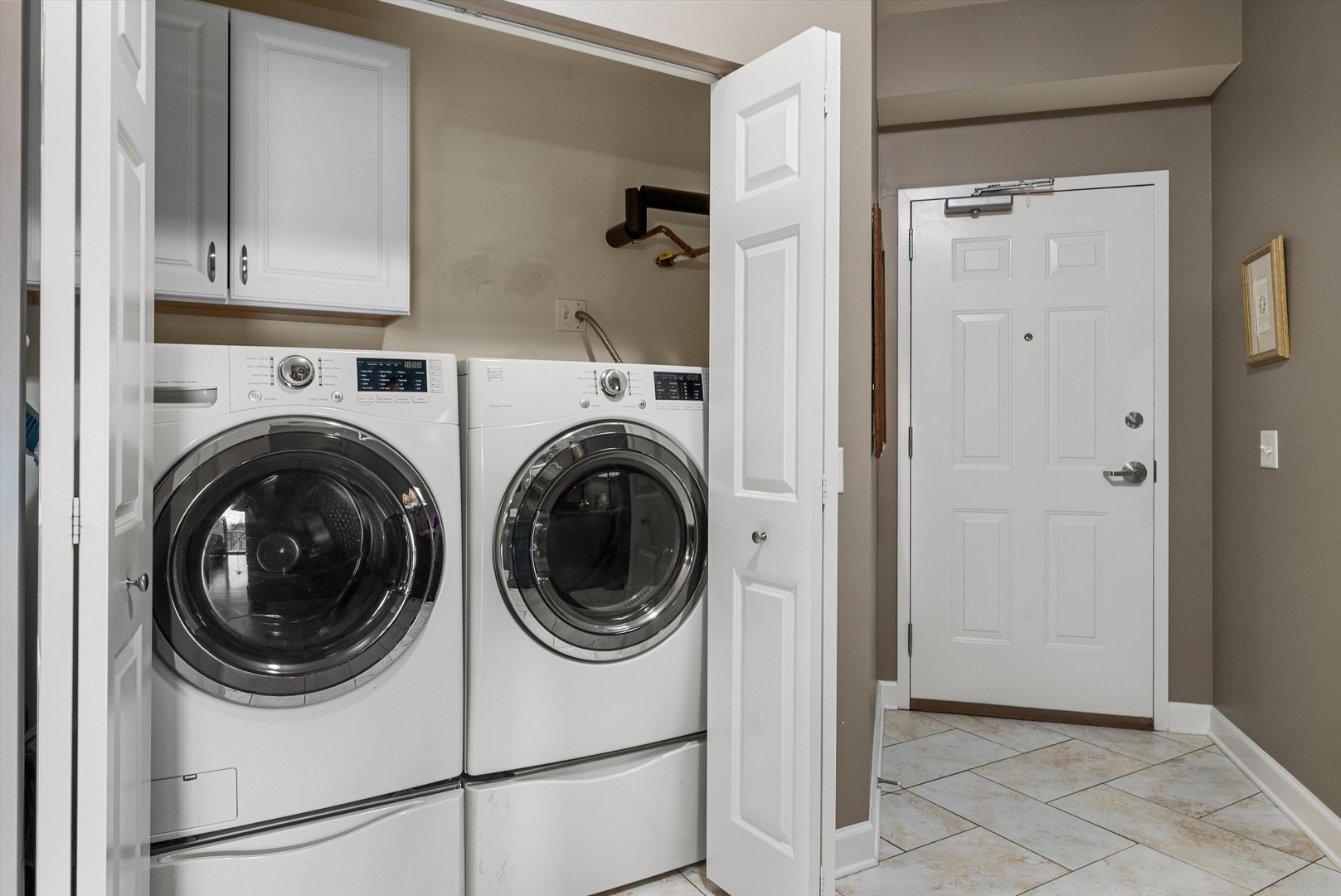 10 North Gilbert Street, Unit 314 South Elgin, IL 60177 - Photo 21 of 25 a view of a hallway with washer and dryer