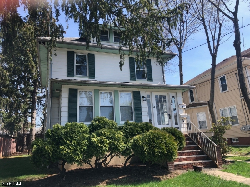 123 Clark Street Dover, NJ 07801 - Photo 12 of 12 a front view of a building with garden
