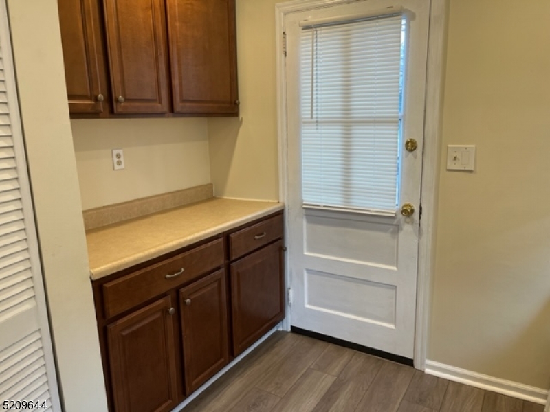 123 Clark Street Dover, NJ 07801 - Photo 7 of 12 a view of storage and utility room with wooden floor