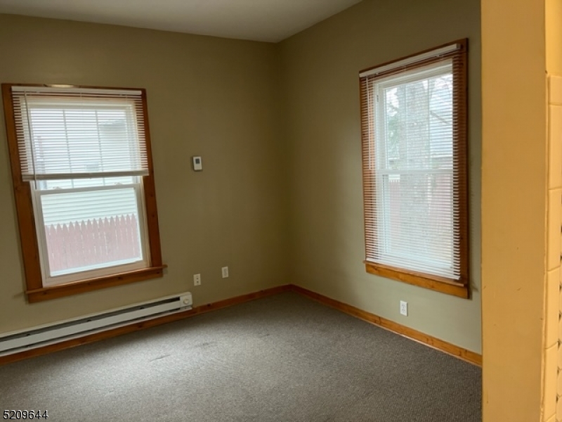 123 Clark Street Dover, NJ 07801 - Photo 8 of 12 an empty room with a window