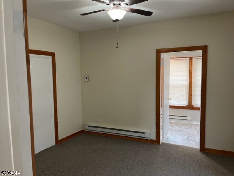 123 Clark Street Dover, NJ 07801 - Photo 9 of 12 a view of an empty room with a window