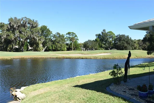 a view of a lake with a yard