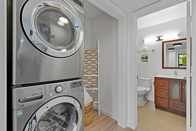a view of a storage and utility room with washer and dryer