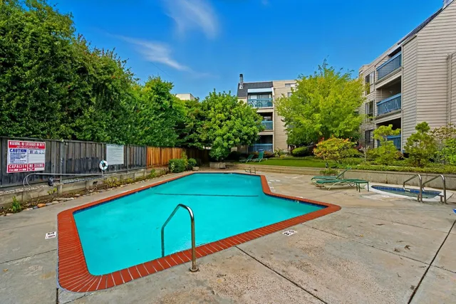 a view of a swimming pool with a lounge chairs