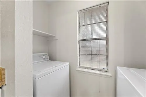 a utility room with dryer and washer