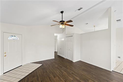 4626 Larner Street The Colony, TX 75056 - Photo 5 of 27 a view of a room with wooden floor and a ceiling fan