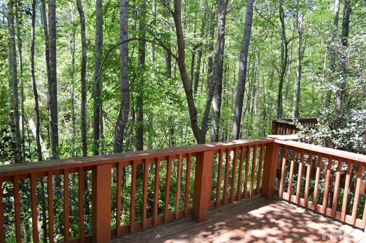 1945 Trexler Court Raleigh, NC 27606 - Photo 12 of 13 a balcony with trees in the back