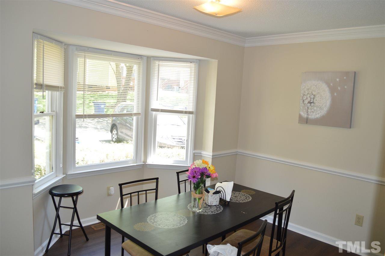 1945 Trexler Court Raleigh, NC 27606 - Photo 3 of 13 a view of a dining room with furniture and window