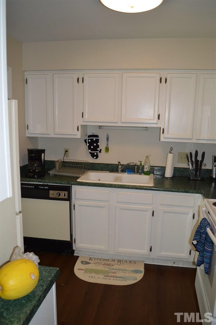 1945 Trexler Court Raleigh, NC 27606 - Photo 4 of 13 a kitchen with a sink and cabinets