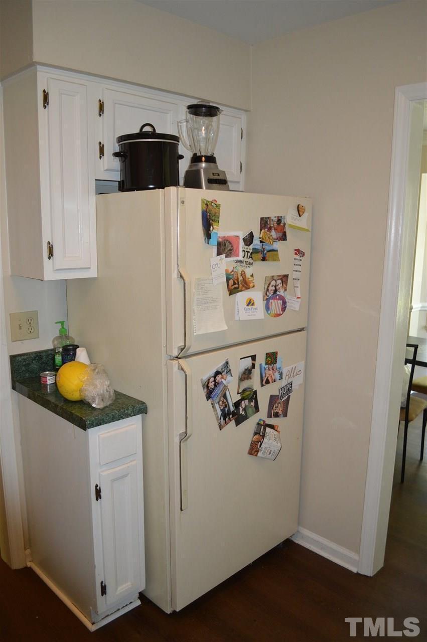 1945 Trexler Court Raleigh, NC 27606 - Photo 6 of 13 a white refrigerator freezer sitting inside of a kitchen