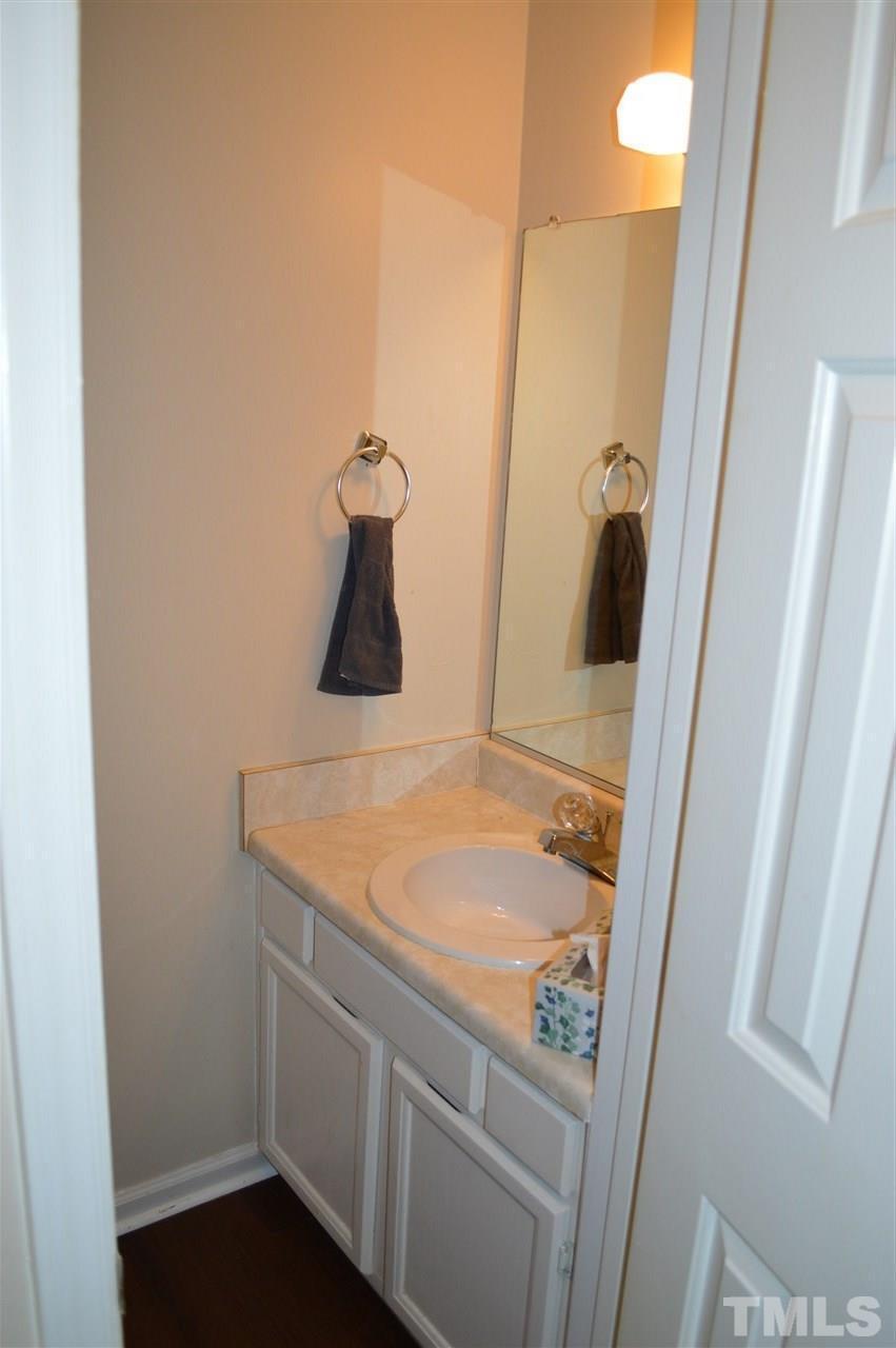 1945 Trexler Court Raleigh, NC 27606 - Photo 7 of 13 a bathroom with a sink and mirror