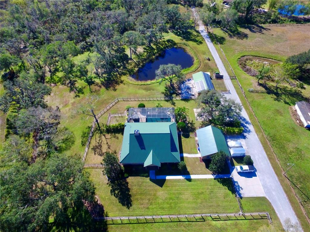 6931 Old Ranch Road Sarasota, FL 34241 - Photo 1 of 1 Looking south. The shell driveway connects the buildings, and leads to the unimproved section in the back.